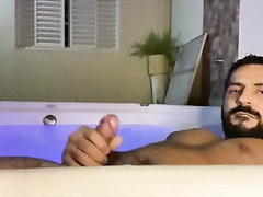 Alone wet relaxing in my hot tub, playing with my big cock until I cum a lot
